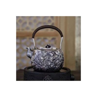 China Durable Large-capacity Du Dan Ancient Chinese Heritage Hand-carved Tea Set Embossed Kettle for sale