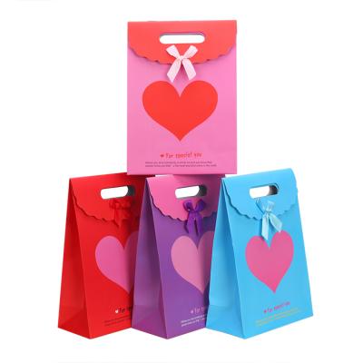 China Beautiful Recyclable Custom High Quality Fashion Accessories Paper Bag Boutique Gift Bag With Bow Wholesale for sale