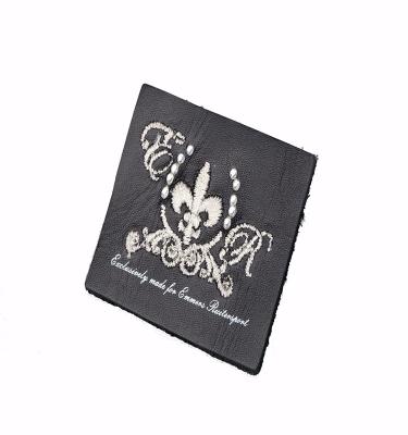 China New China Fashion Sustainable High Quality Custom Embroidered Real Leather Label For Clothing for sale