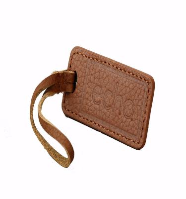 China Sustainable New China Fashion Custom Embossed Leather Label With Metal Logo for sale