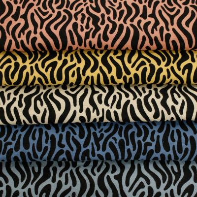 China Viable in stock new 100% flannel fleece fabric cotton leopard zebra tiger print fabric for shirts dress block brush prints fabrics for sale