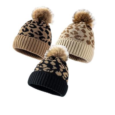 China RWH2040 Faux Fur Pom Knitted Leopard Hat Outdoor COMMON Warm Winter Autumn Wool Beanie Hat Woman for sale