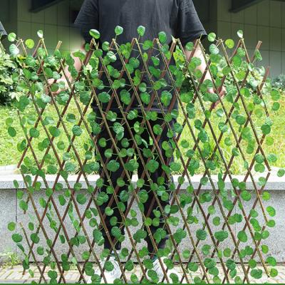 China Minimalist 1.2m Can Stretch Wholesale Green Ivy Trellis Artificial Garden Plant Fence for sale