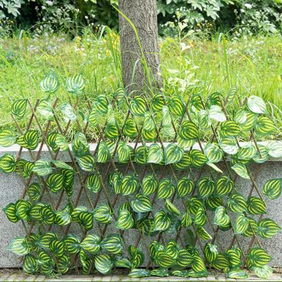 China Minimalist 1.2m Can Stretch Wholesale Green Ivy Trellis Artificial Garden Plant Fence for sale