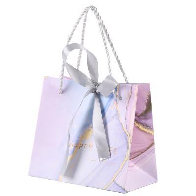 China White Bowknot Ribbon Paper Bag Recyclable Bulk Printing Tote Shopping Packaging Bags With Handles for sale