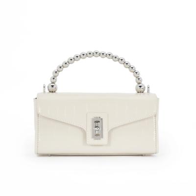 China 2021 high quality fashion messenger creative women bag white cowhide steel ball handbags for sale