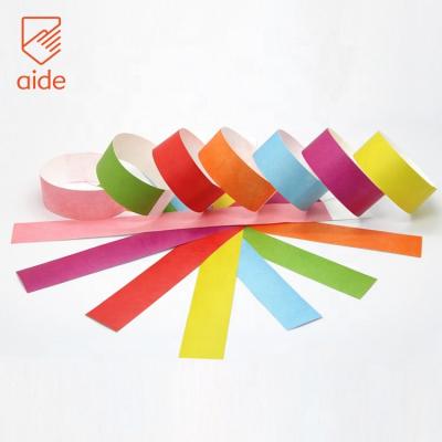 China HELP Wholesale Tyvek Wristbands Waterproof Event Paper Bands 7 Solid Colors Available In Stock for sale