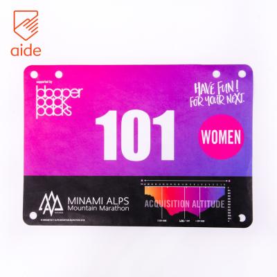 China Waterproof High Quality Custom Printed A5 Size Waterproof Tyvek Race Number Paper Bibs Disposable for sale