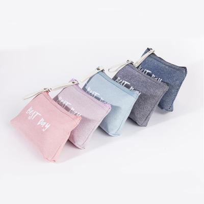 China Fashion Letter Small Cosmetic Bag Cloth Art Travel and Play Canvas Portable Makeup Leisure Cosmetic Bag for sale