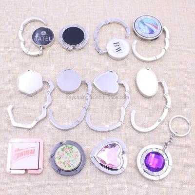 China Ladies Shape Gifts Round, Rectangle, Oval, Heart Shape Bag Hanger/Wholesale Print Epoxy Logo/Laser Purse Hanger for sale