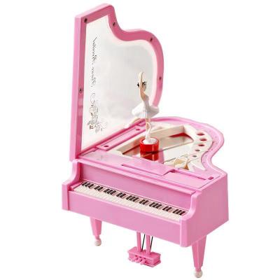 China e-commerce plastic hot goods products mini piano wooden crystal music box for sale