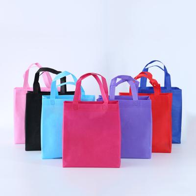 China Reusable Reusable Custom Non Woven Grocery Tote Bag Large Printed Colorful Nonwoven T-shirt Bag for sale