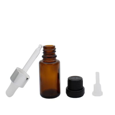 China Hot sales personal care 15ml essential oil bottles with glass dropper and with middle hole cover for sale