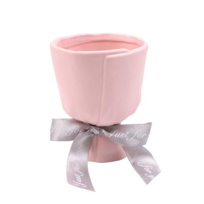 China Minimalist creative hand holding living room vase-shaped bouquet flower pot succulent scam in ceramic flower arrangement fresh simulation flower for sale