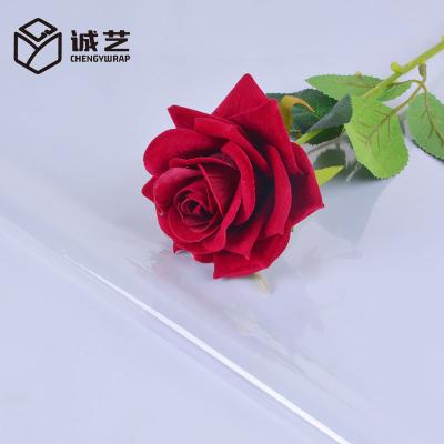 China Good Quality 60pcs Cellophane Plastic Packaging Paper Waterproof Dustproof Bouquet Florist Gift Transparent Waterproof Wrapping Paper for sale