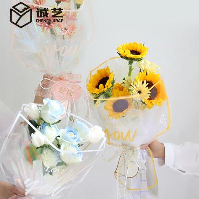 China 2022 Waterproof Product Border Letter Pattern Display Clear Plastic Flower Wrapping Bag Transparent Waterproof Opp Flower Packaging Paper for sale