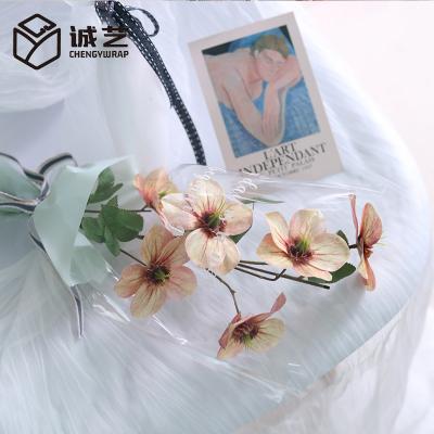 China New Arrival Waterproof Flowers Thicker Waterproof Flower Bouquet Gift Cellophane Paper Love Style Opp Wrapping Paper for sale