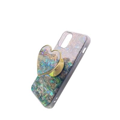 China New Natural Shell Pattern Round Shaped Griptok Adjustable Grip Cool Magic Adjust Folding Cell Phone Stand Telescopic Stand For iPhone for sale