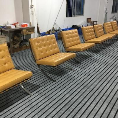 China Mid Century Modern Classic Chair 304 Stainless Steel Solid Metal Base Chair With Real Leather Upholstery for sale