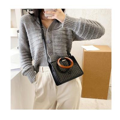 China Other Custom PU Tote Denim Braiding Bag Famous Leather Handbag Brands Jelly Small Handbags With Wooden Handle Designer for sale