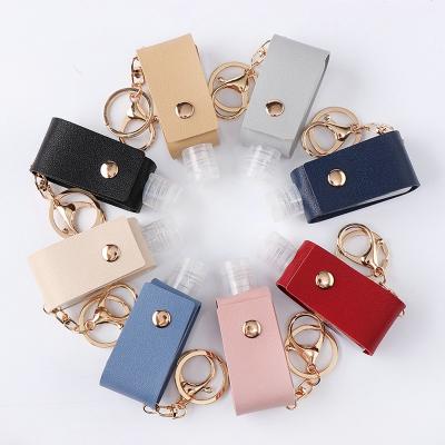 China New Fashion PU Hand Sanitizer Bottle Key Ring Bag Pendant Portable Sanitizer Stainless Steel Hook Moving Key Case for sale