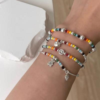 China 2022 Casual/Sporty Korean Minimalist Vintage Colorful Seed Beads Bangle Smile Bear Face Rainbow Charm Elastic Bracelets for sale