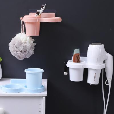 China Wall Mounted Home Appliance High Quality Bathroom Storage Rack Soft Plastic Hair Dryer Rack for sale