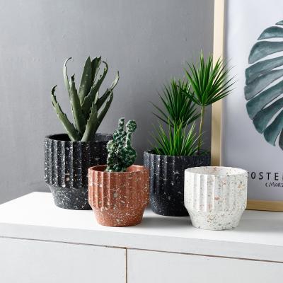 China Nordic Europe style simple creative potted green plant around the large throw stone point perforated cement flower pots for sale