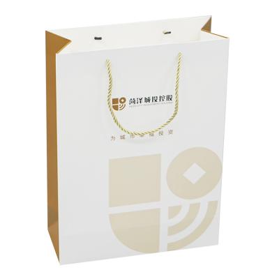 China Luxury Wholesale Recyclable Matte Black Gift Shopping Paper Bag With Logo Bag For Clothing Custom Packaging for sale