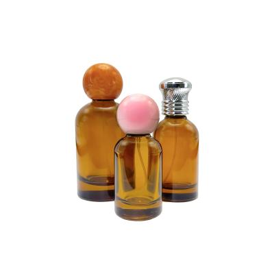 China Cosmetic Luxury Wholesale Custom Round Cylinder shaped Spray Glass Perfume Empty Bottle Essential Oil Fragrance Bottle 30ml 50ml 100ml for sale