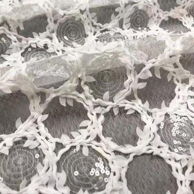 China Latest Viable Exquisite Bridal Dress White Crochet Lace Fabric With Sequins for sale