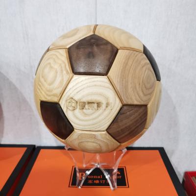 China Modern Solid Wood Black Walnut Football Craft Making Football Creative Gift For Adult Or Kids Splicing Ball for sale