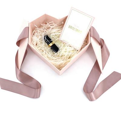 China Recycled Materials Heart Shape Small Cosmetic Pink Kraft Paper Material Durable Cardboard Box With Ribbon for sale