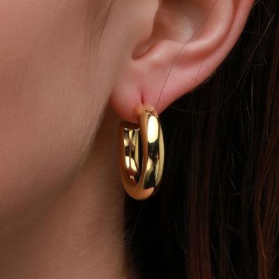 China FASHIONABLE Tasty minimalist round huggie perforation arete C hollow gold colored shape earring circle open earring for sale