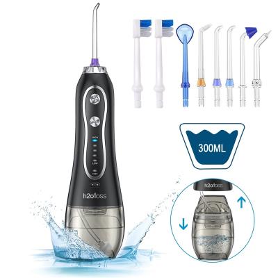 China Outdoor Waterproof Portable Dental Water Flosser Teeth Irrigator IPX7 Refillable h2ofloss With 5 Nozzles for sale