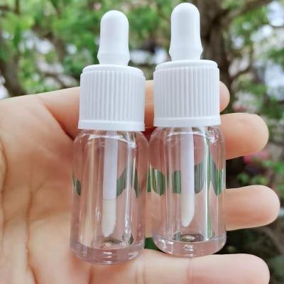 China 4ml Low Moq Lip Gloss Packaging High Quality Clear Dropper Bottle Luxury Shape Plastic Empty Lip Gloss Tubes for sale