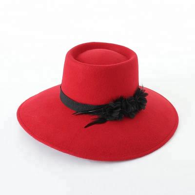 China Big JOINT brim down lap wool felt hat women winter hat with flower and feather for sale