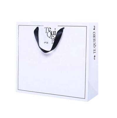 China OEM Recyclable High Level Custom Gift Black Hot Stamping Paper Bag For Packaging for sale