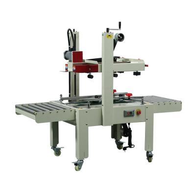 China FXJ6060 Semi Automatic Food Top And Bottom Drive Manual Flaps Folding Adhesive Tape Case Closing Machine for sale