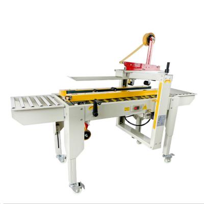 China Semi Automatic Food Aircraft Box Sealing Machine Crate Sealer Carton Sealing Machine for sale