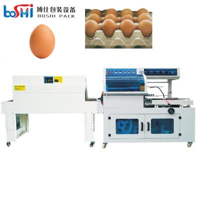 중국 Automatic POF PVC shrink film Egg shrink wrap machine egg shrinking tunnel packing machine 판매용