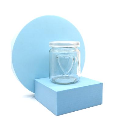 China Recyclable Clear Mini Glass Jam Jar Pudding Yogurt Jar Heart Shaped Pudding Bottle for sale