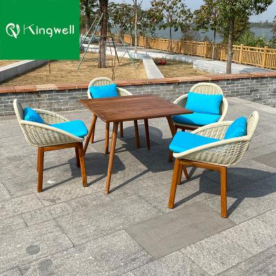 China Modern Luxury Outdoor Garden Furniture Rattan Dining Chair And Wooden Table Set for sale