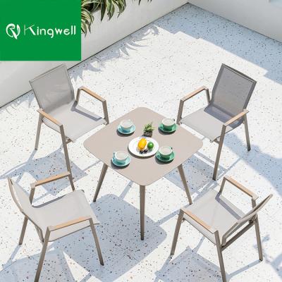 China Modern Garden Outdoor Table Set 8 Stacking Dining Chair And Aluminum Coffee Table for sale