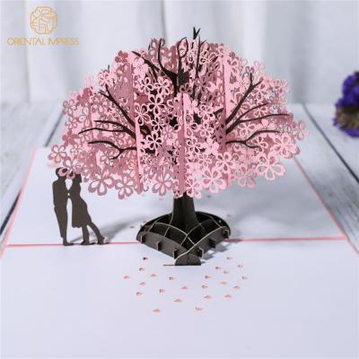 China Universal Exquisite Paper Cutting Pop Up Cherry Blossom Tree Folding Valentine's Day Card Wedding Invitation Card for sale