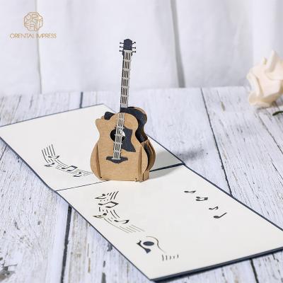 China Universal 2022 New Paper Art Handmade Gift Birthday Card Pop Up Guitar 3D Greeting Card for sale