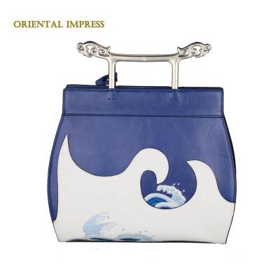 China 2021 new oriental fashion embroidery design handmade lady whip leather handbag women bag with silver handle for sale