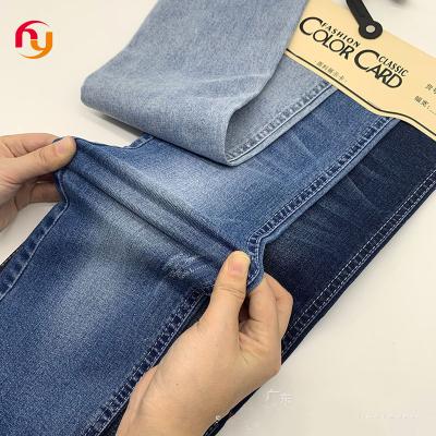 China Breathable good price high quality stretch knitted denim jeanS fabric Slub cotton spandex indigo raw denim fabrics for sale