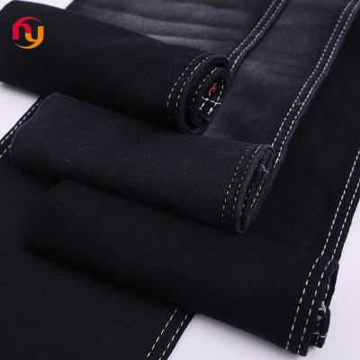 China Breathable suppliers stock lot wholesale color knitted jeans cloth material 8oz cotton stretch satin raw denim jean fabrics for sale