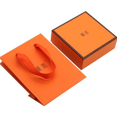 China High Quality Handmade Hot Foiled Stamping Orange Matt Kraft Paper Box and Paper Bag Set for sale